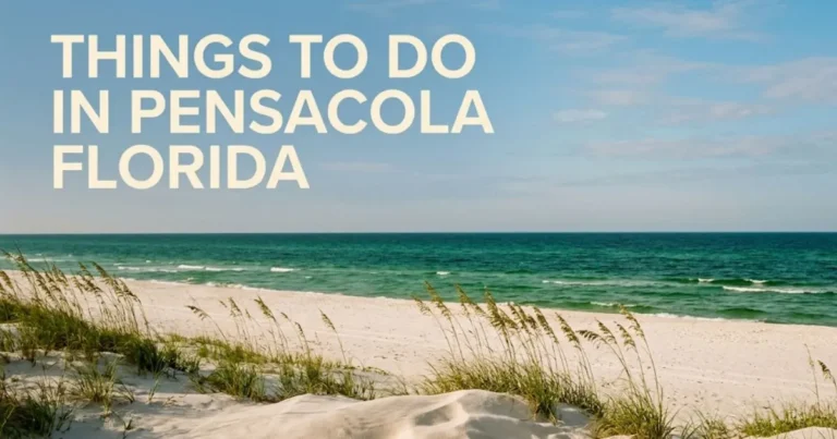 An empty sugar-white sand beach at Gulf Islands National Seashore with emerald water, showcasing the best of things to do in Pensacola Florida.
