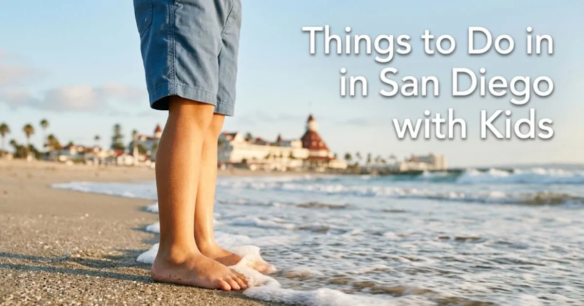 Child's feet in gentle surf at Coronado Beach San Diego with Hotel del Coronado background, family travel guide for things to do in San Diego with kids.