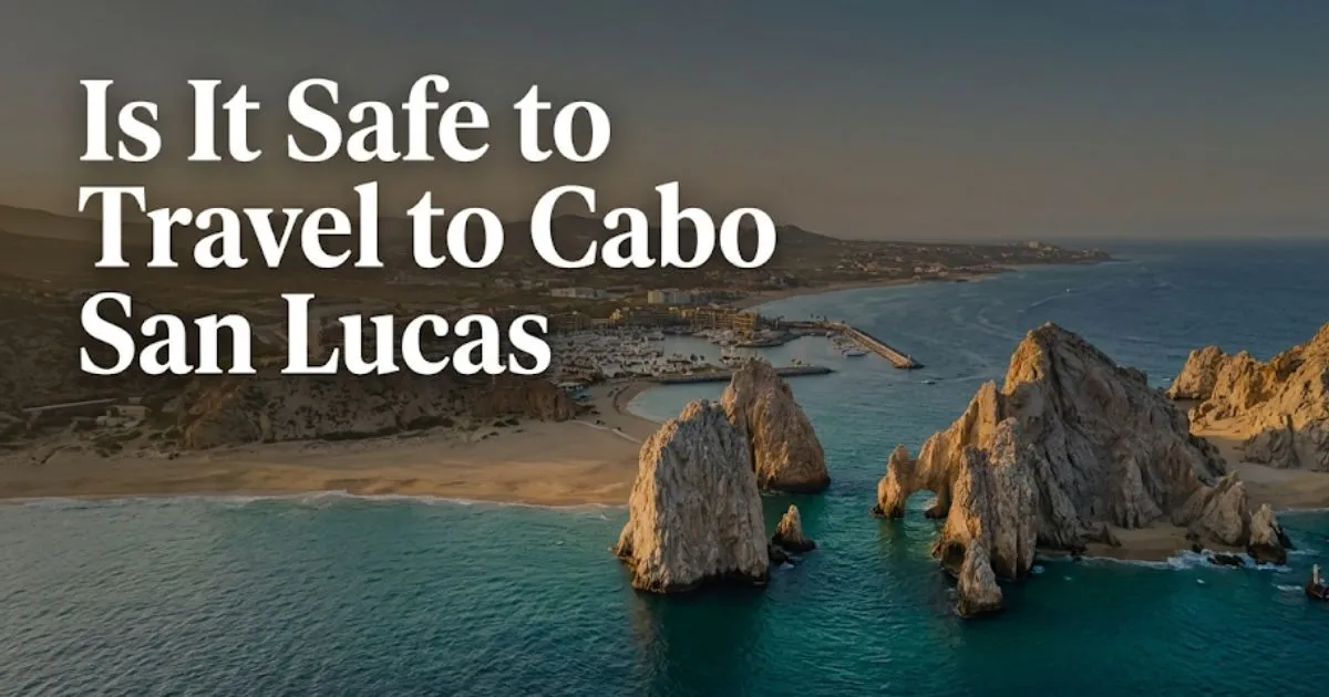 Is it safe to travel to Cabo San Lucas aerial view of El Arco, Cabo Marina, and the Sea of Cortez at golden hour.