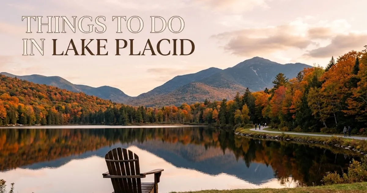 Mirror Lake at autumn sunset with Adirondack High Peaks reflected in calm water, Adirondack chair in foreground, things to do in Lake Placid guide hero image.