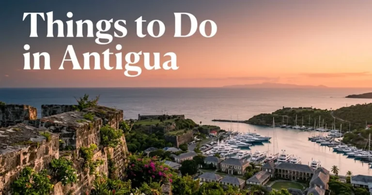 View from Shirley Heights Lookout over English Harbour at sunset with text reading things to do in Antigua overlaid on the sky.